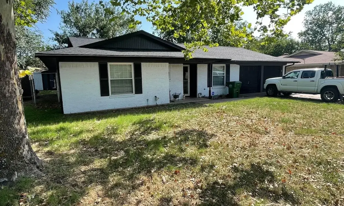 Professional roofing crew working on a residential roof in Summit Park